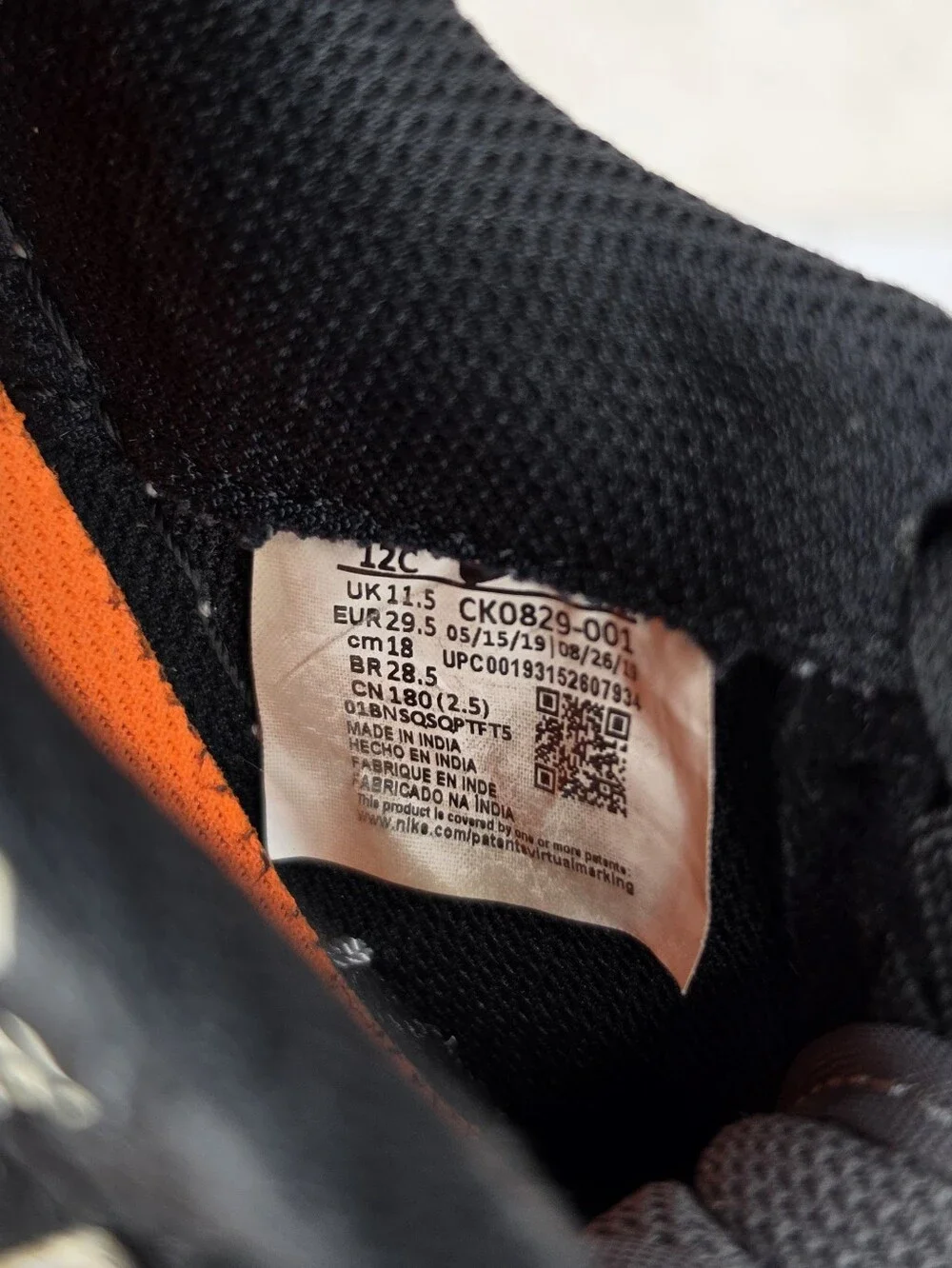 Nike Air Force Lv8 Kids Black & Gray Low-Top Sneakers with Orange Accent